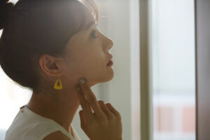 A young Asian business woman thinks seriously A young Asian business woman thinks seriously
